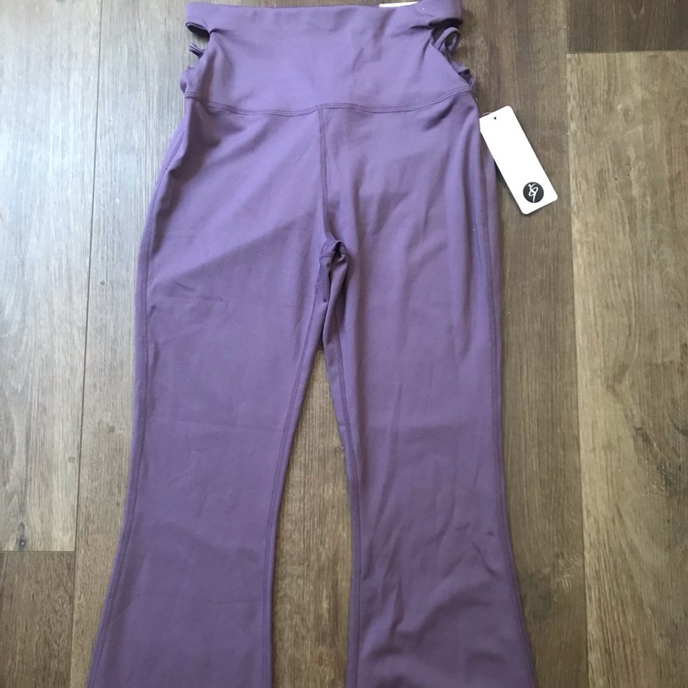 Otos Active Wear yoga pants. Flare leg at bottom. Sides are cut out.💜 - Picture 2 of 4